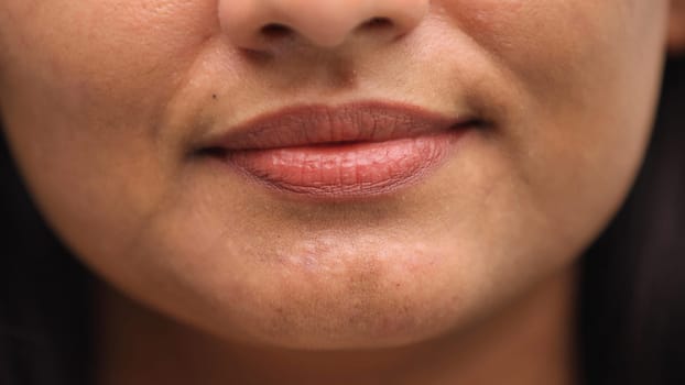 woman's mouth with a serious expression close-up