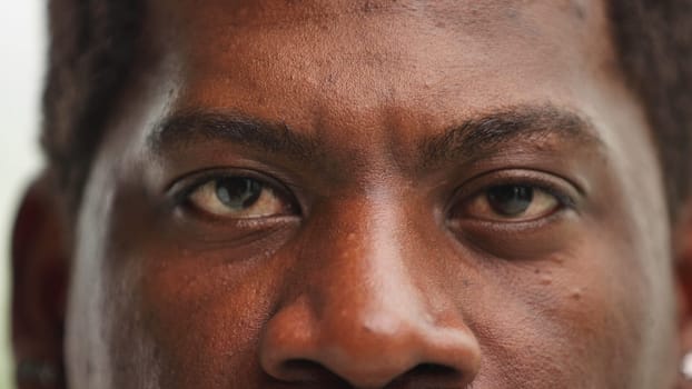 Close-up of the eyes and nose of a confident black man