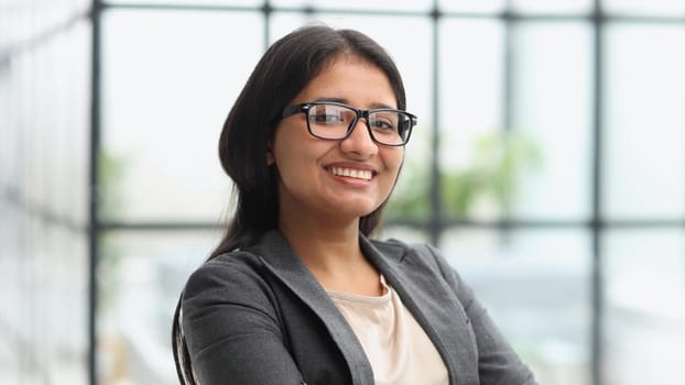 Beautiful young business woman at the office working place