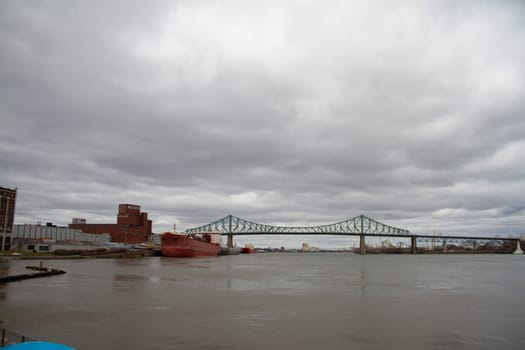 View of Jacques Cartier bridge in the city of Montreal, Quebec, Canada during an overcast day