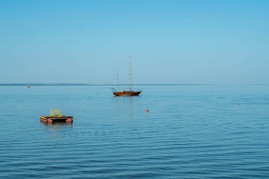 yachts on the water against the blue sky. photo