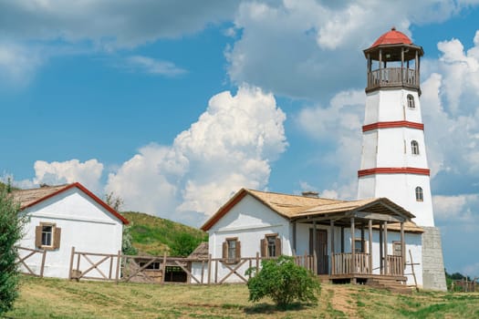 the old lighthouse against the blue sky. photo