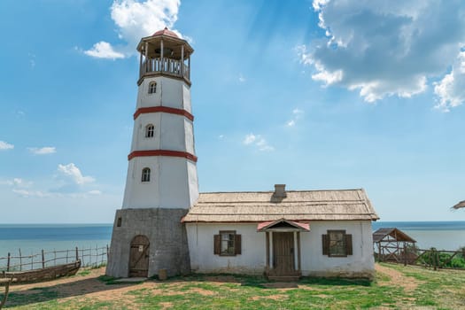 the old lighthouse against the blue sky. photo