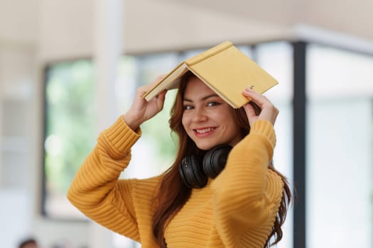 Beautiful young Asian woman college student at classroom. College student working on the college campus. back to school concept.