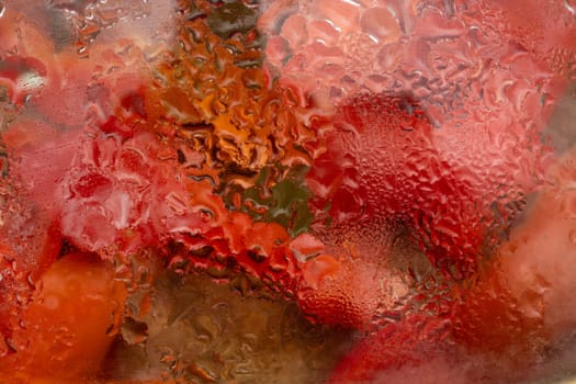 Drops on the glass lid of the pan in which the food is being prepared. Abstract background.