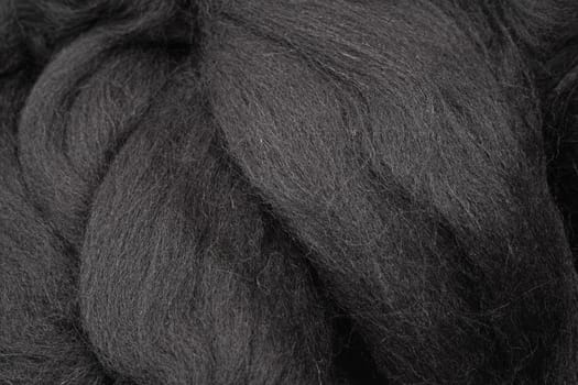 Black merino wool for felting as background