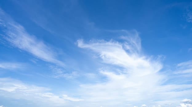 Blue sky and white cirrocumulus clouds texture background. Blue sky on sunny day. Summer sky. Cloud formation. Fluffy clouds. Nice weather in summer season. Weather pattern. Atmospheric phenomenon.