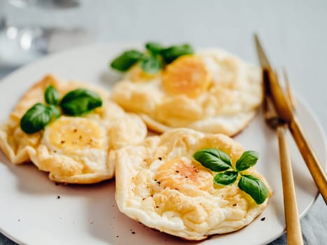 Fluffy Cloud Eggs. Trendy food - oven bake scrambled eggs with whipped egg white and whole yolk on plate