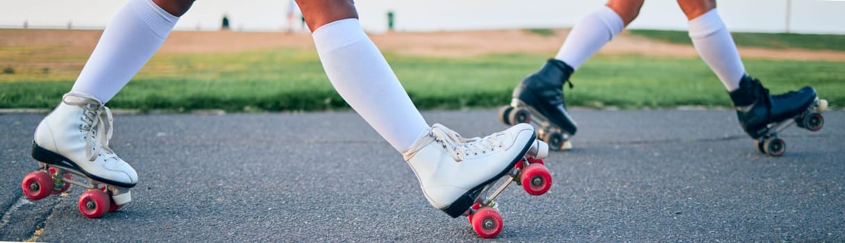 Legs, roller skates and shoes of friends on street for exercise, workout or training outdoor. Skating, feet of people and sports on road to travel, journey and moving for freedom, hobby and fitness.