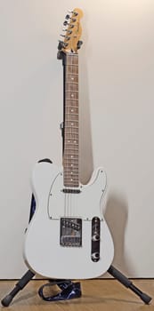 Itterbeck, Germany - June 28 2023 _ A polar white Fender Telecaster  electric guitar on a guitar stand