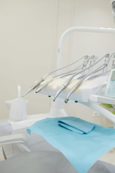 Set of professional equipment in dentist's office. Interior of a dental clinic. Dental office without people. Dentist's instruments, equipment and tools.