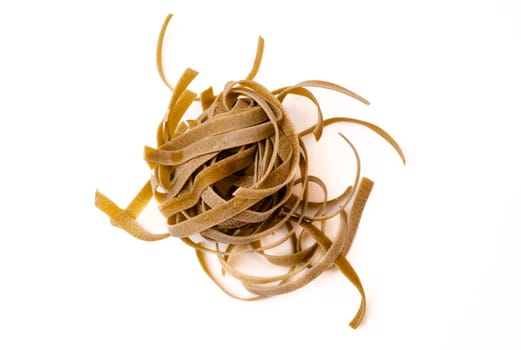 One nest of green noodles on a white background.