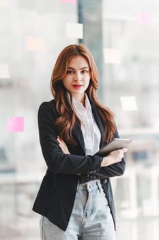 Portrait of young happy woman and confident business at office.