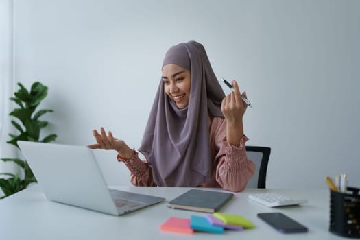 Beautiful young teen asian business woman meeting at on computer laptop with planning working on financial document, tax, exchange, accounting and Financial advisor.