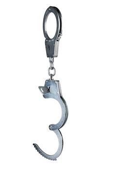 real zinc plated steel police handcuffs half-opened with key hanging vertically, isolated on white background.