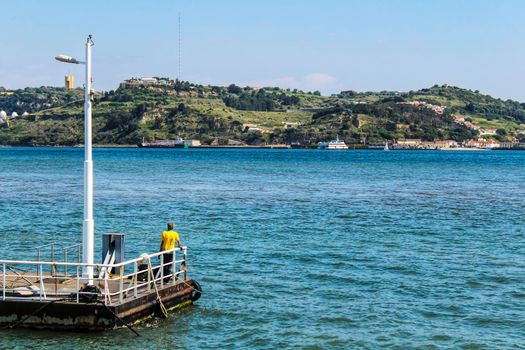 Lisbon, Portugal- 19 May, 2018:Tourist on the banks of Tagus river in Lisbon