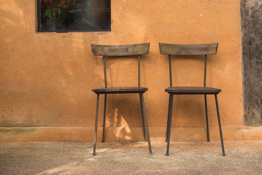 wooden chair and brown wall