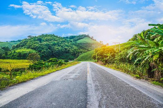 mountain road blue sky