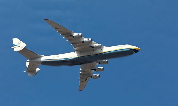KYIV, UKRAINE - Aug 24, 2021: Celebrating the 30th anniversary of Ukraine independence. The plane Antonov 225 AN-225 Mriya, the biggest airplane in the world in the sky over Kyiv during the parade