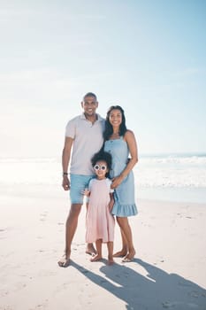 Summer, beach and portrait of happy family together at the sea or ocean bonding for love, care and happiness. Travel, sun and parents with child or kid on to relax in mockup space on outdoor holiday.