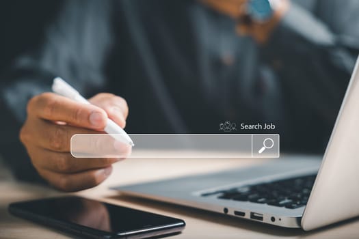 Man using a digital pen to point at an online job search bar, symbolizing the quest to find the perfect career opportunity amidst a sea of information and possibilities. job search