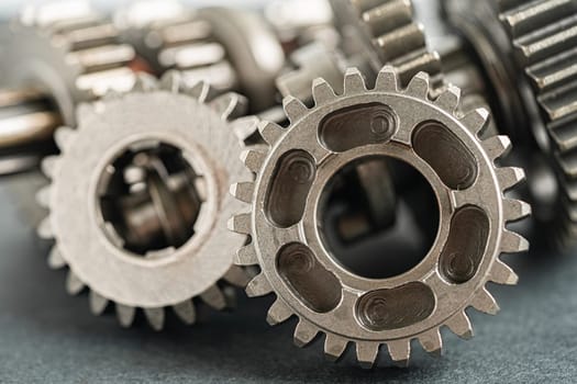 Gear and cogs wheels, clock mechanism, brass metal engine industrial.