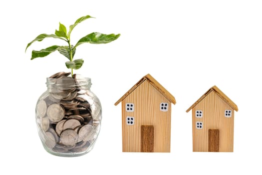 House model with growing plant on stack of coin money, home loan, saving plan, installment payment finance and banking concept.