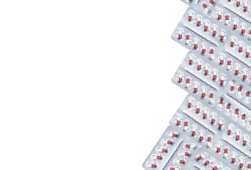 White-red capsule pill in blister pack isolated on white background. Prescription drug. Pharmaceutical industry. Pregabalin for nerve pain and anticonvulsant. Neuropathic drug. Pharmaceutical drug.