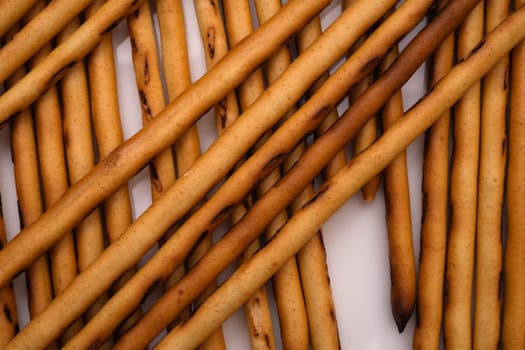Bread sticks on white background.