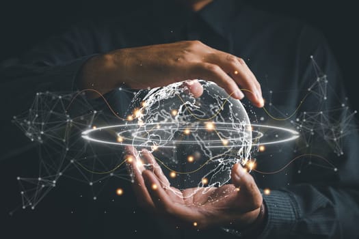 Connected in Digital Era, Businessman hand holds globe, illustrating interconnectedness facilitated by technology. Big data analytics and business intelligence revolutionize global decision processes.