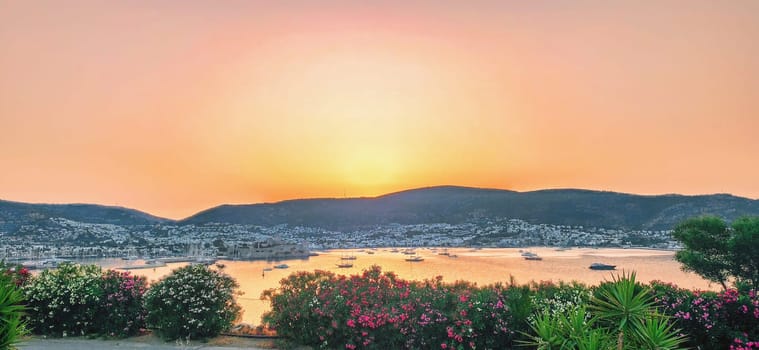 Sunset over mountains and reflection on the sea in the small city Bodrum in Turkey. download photo