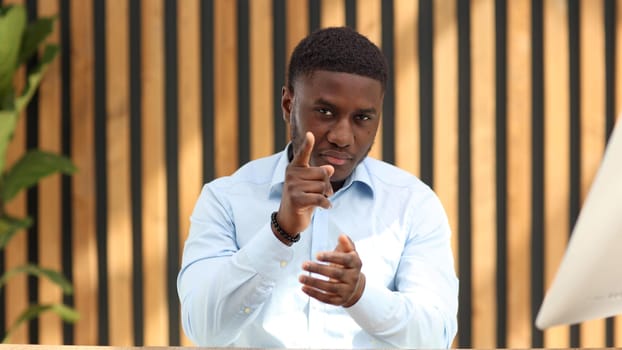 Portrait of a confident senior man businessman, accountant, manager sitting in the office at the table