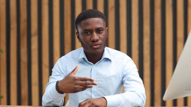 Portrait of a confident senior man businessman, accountant, manager sitting in the office at the table