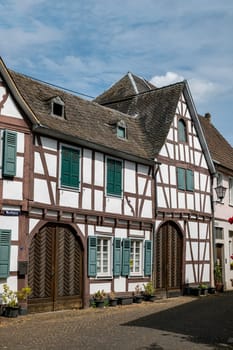 Half timbered architecture in Erpel, Rhineland Palatinate, Germany with green shutters and old wooden doors