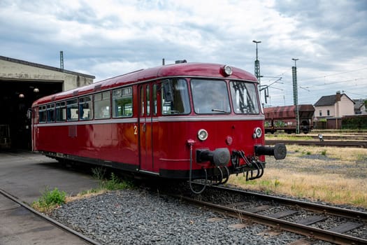 old red abandoned train on old station in linz in germany