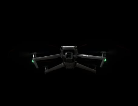 DJI Mavic 3 - in Flying in the dark, on black background. Closeup drone on dark. One of the most popular drones in the market. Modern reconnaissance copter camera. 12.01.2022 Rostov-on-Don. Russia.