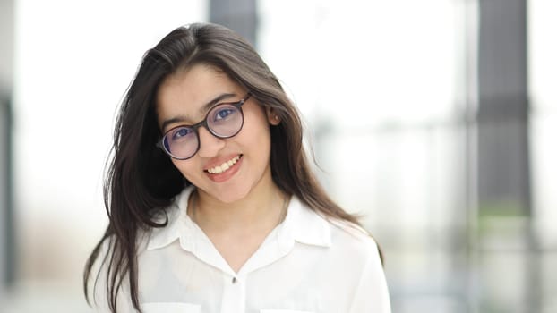 head shot portrait of a preppy, young, beautiful, confident and attractive woman