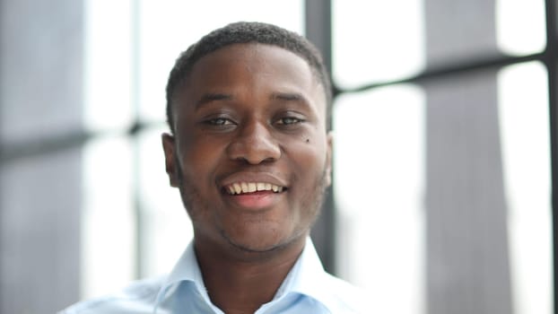 Portrait of an african american businessman in a blue shirt