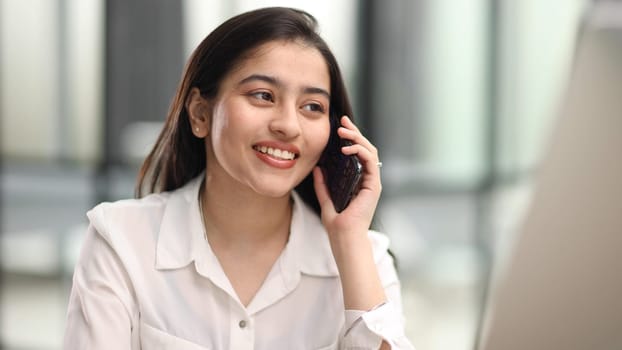 Informal Call. Young woman in glasses calling her friend, talking and asking about something, using laptop