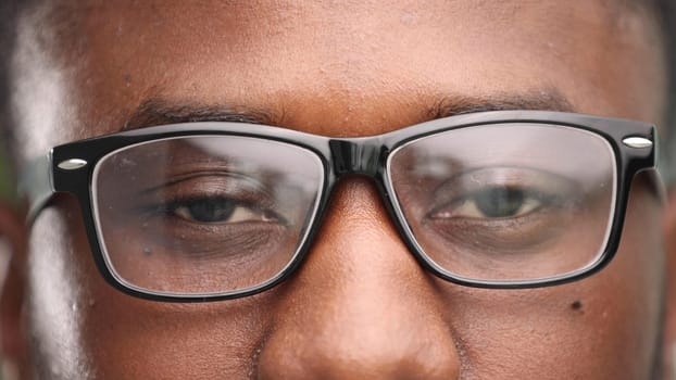 confident african man in pose with closed eyes