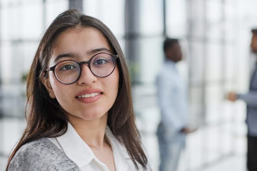 Portrait of girl leader or manager at a team planning
