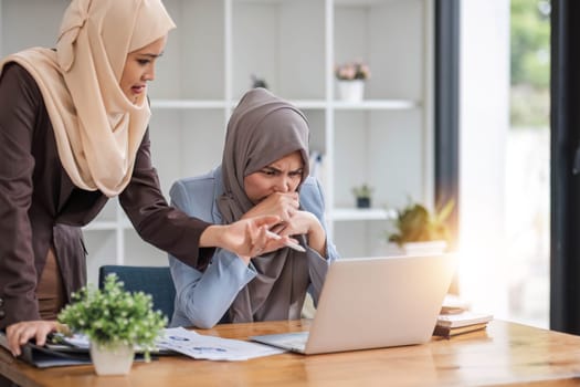 Professional Muslim business team working together, discussing on an important project in the office room...