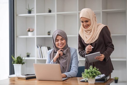 Professional Muslim business team working together, discussing on an important project in the office room. co-working concept..