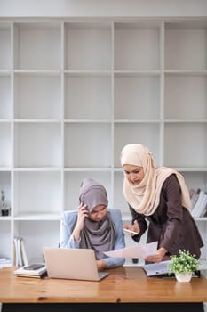 Professional Muslim business team working together, discussing on an important project in the office room...