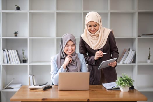 Professional Muslim business team working together, discussing on an important project in the office room. co-working concept..