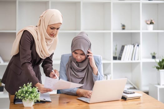 Professional Muslim business team working together, discussing on an important project in the office room...