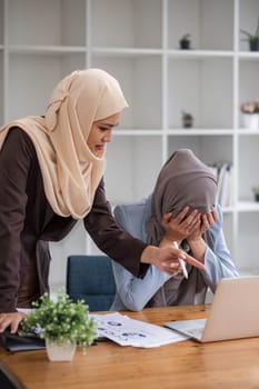 Professional Muslim business team working together, discussing on an important project in the office room...