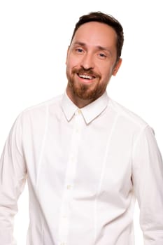 Stylish bearded business man smiling to camera, having pleased expression and cheerful look. Positive emotions concept.