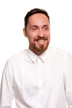 Stylish bearded business man smiling to camera, having pleased expression and cheerful look. Positive emotions concept.