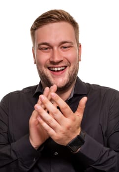 Thrilled excited and over-emotive attractive happy guy smiling broadly gasping and screaming from joy and happiness gesturing with palms clapping hands from surprise and rejoice. Studio portrait on white background